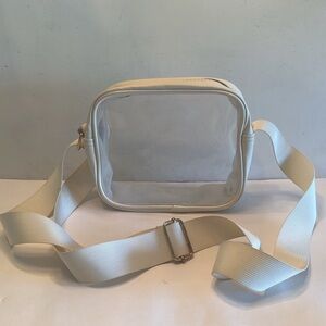 Cream color crossbody see through clear zip close travel bag